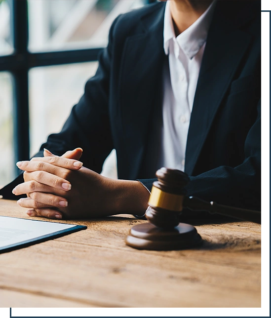 Businessman in suit or lawyer working on a documents.