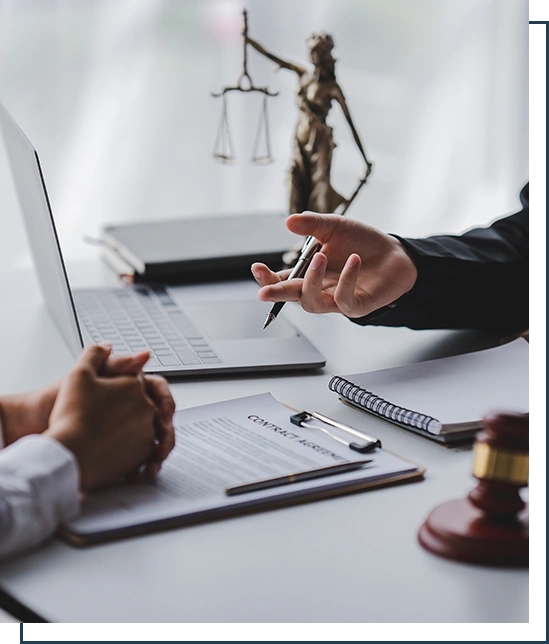 concept of justice and law A male judge in the courtroom on a wooden table and a male counselor or lawyer working in the office